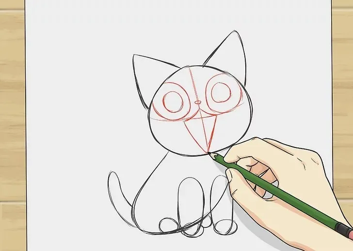 Thêm mắt tròn lớn, mũi nhỏ, miệng xinh và râu mèo hai bên.