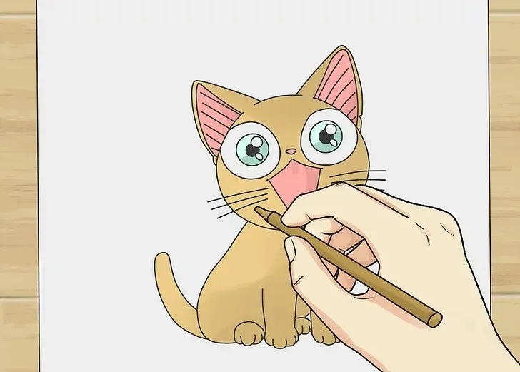 Tô màu hoàn thiện mèo chibi cute với thân vàng, mắt xanh và má hồng.